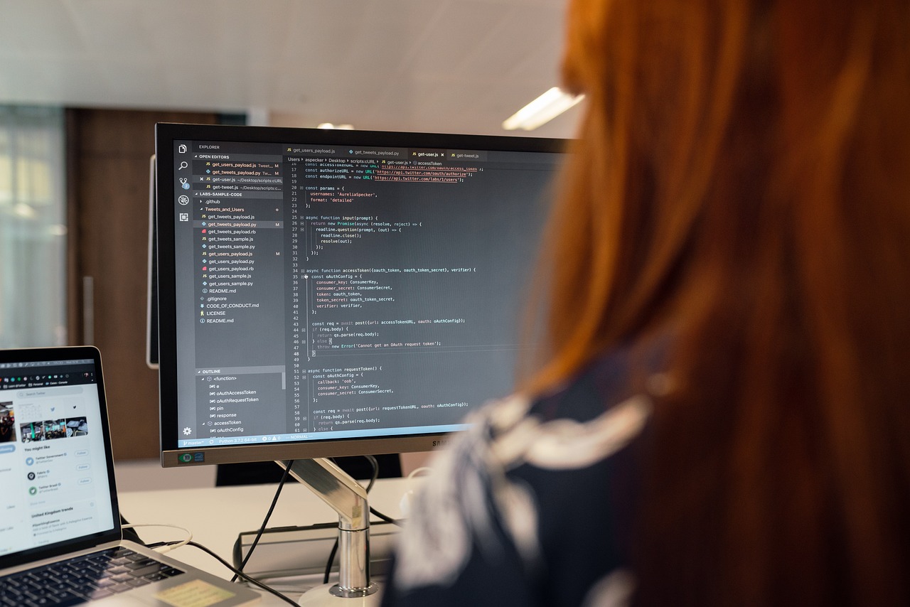 Engineer working across multiple screens