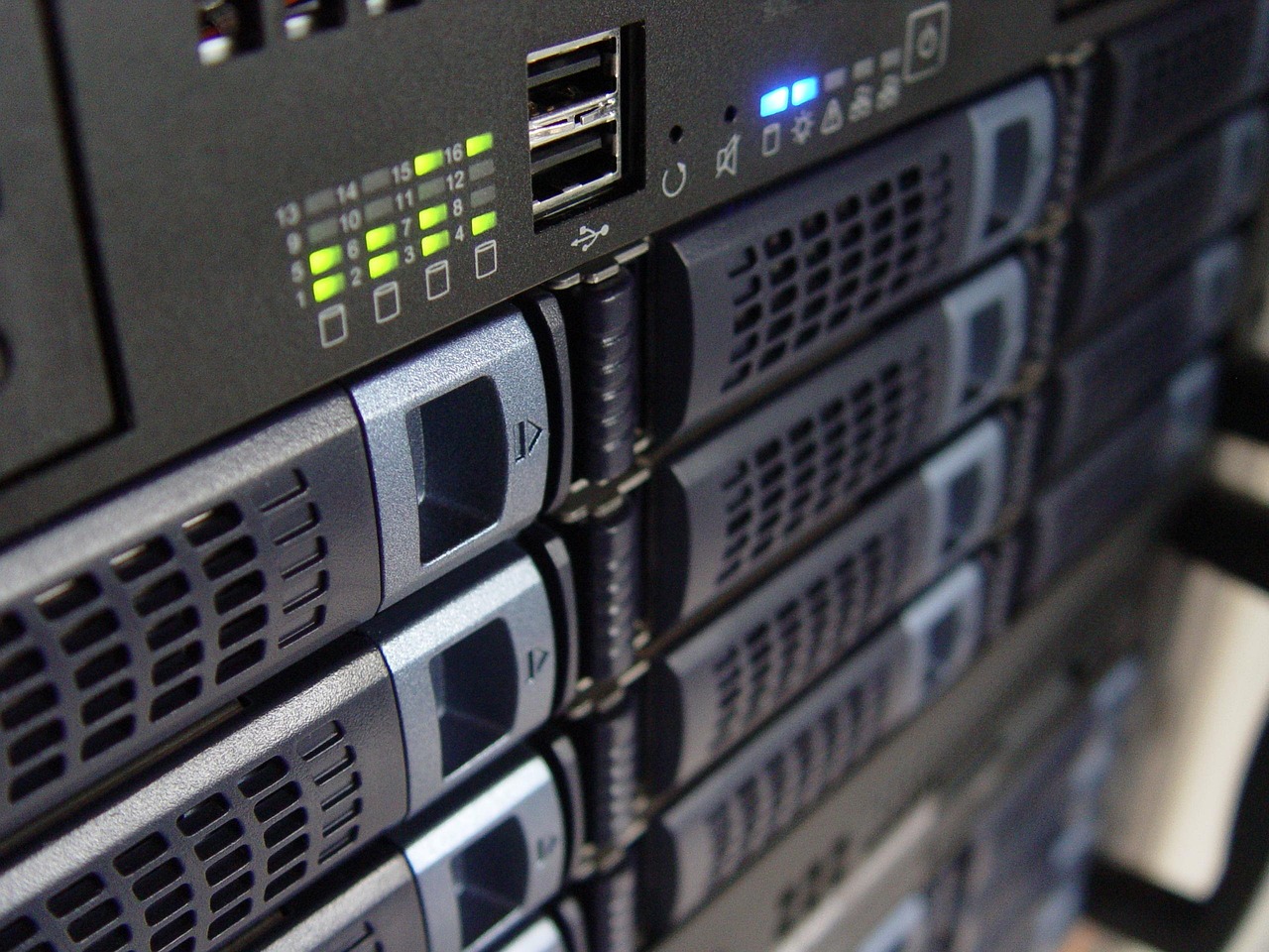 Blue-lit server racks in a data room